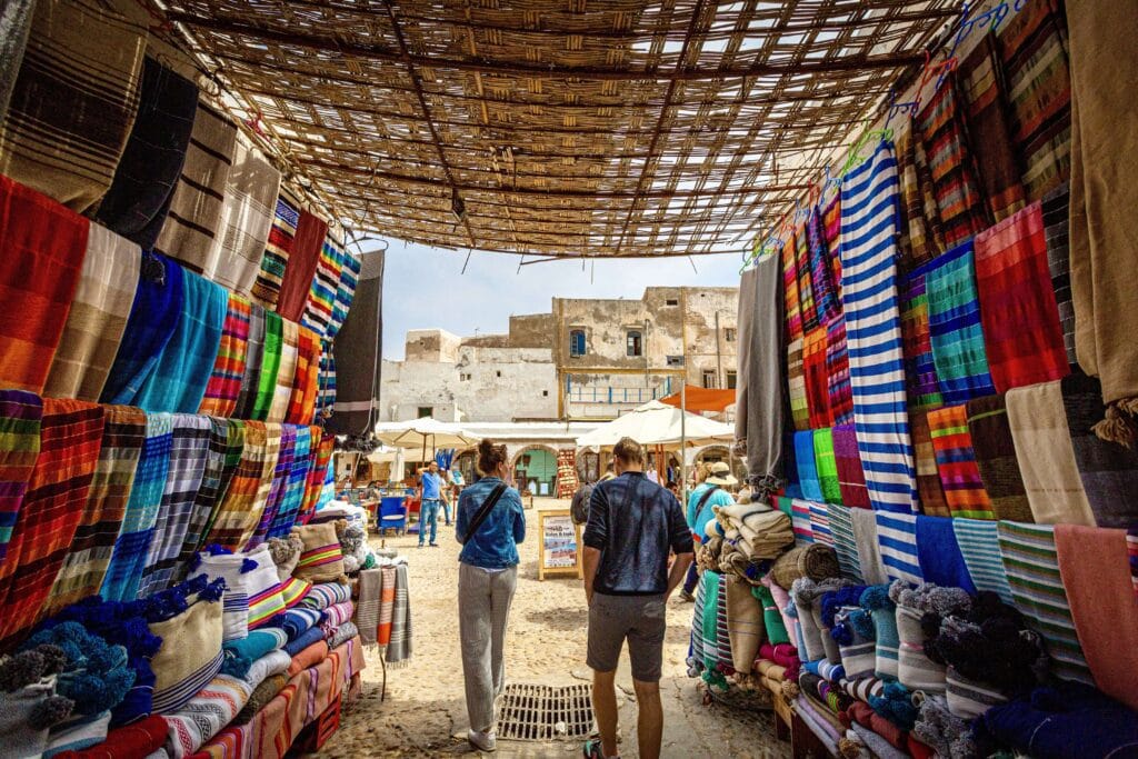 A cou[le walking though a local market in Morocco